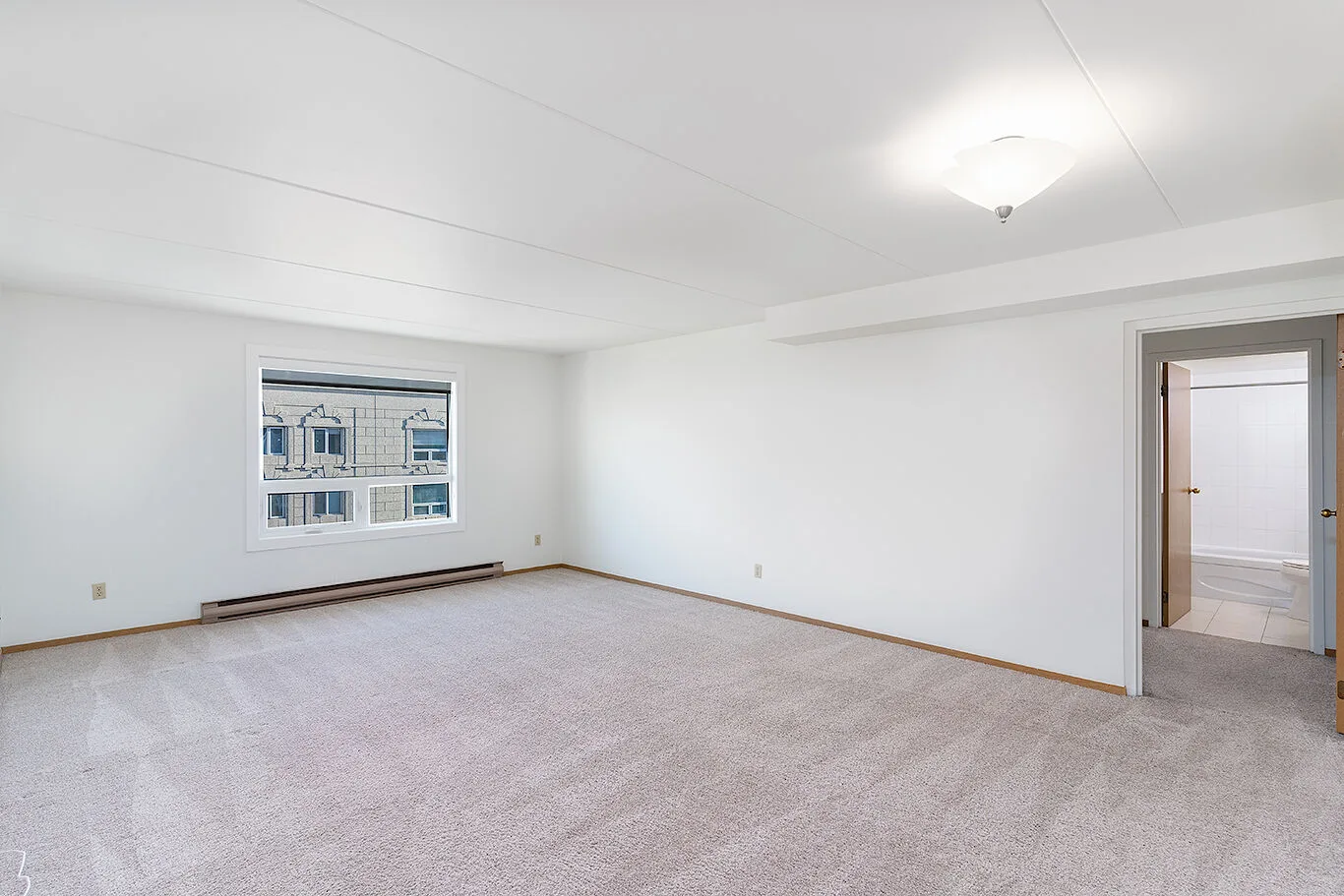 25-floor concrete apartment building located downtown in one of Winnipeg's most iconic buildings