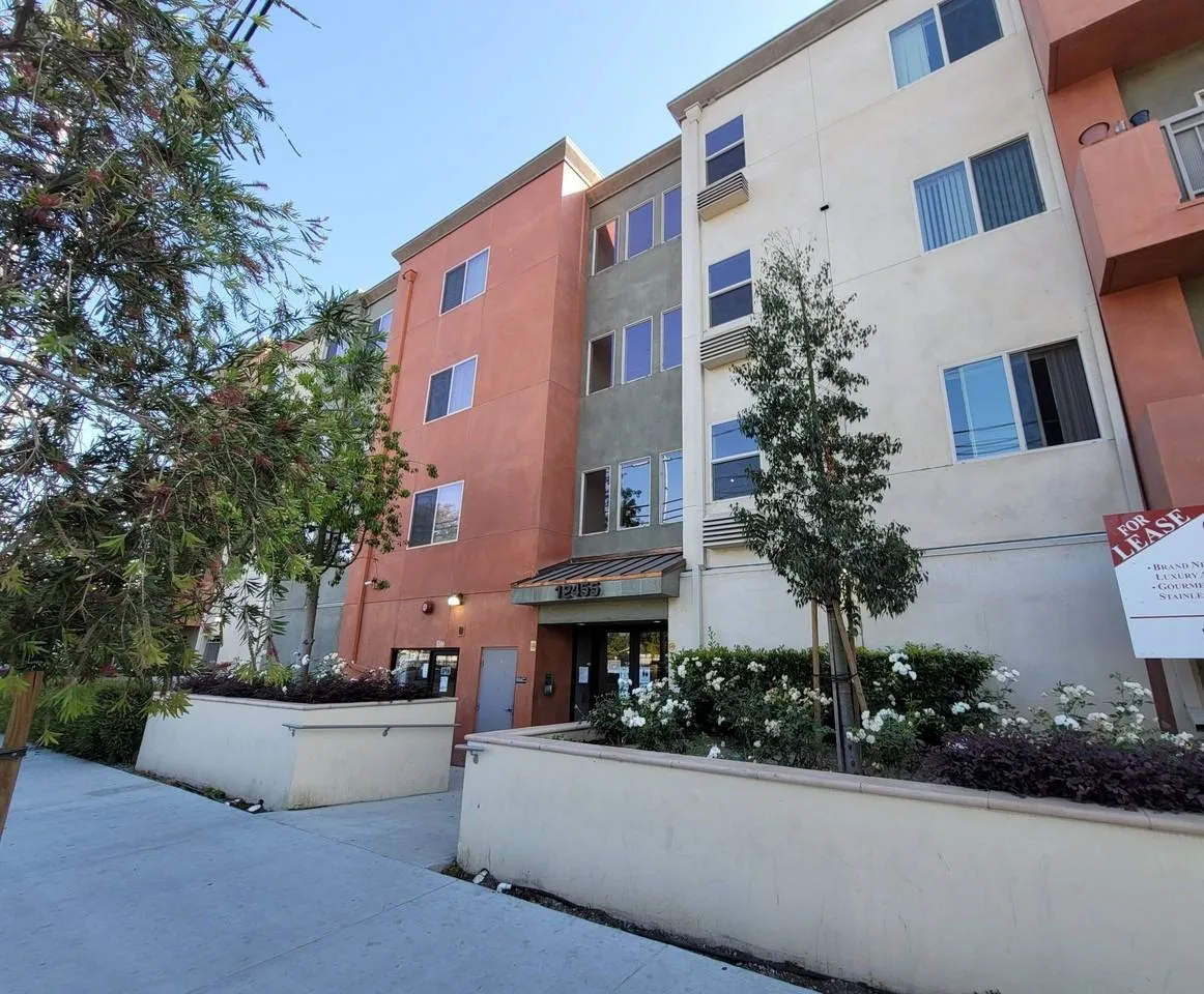 **Cosmo Apartment, LLC / 12455 San Fernando Rd / John
