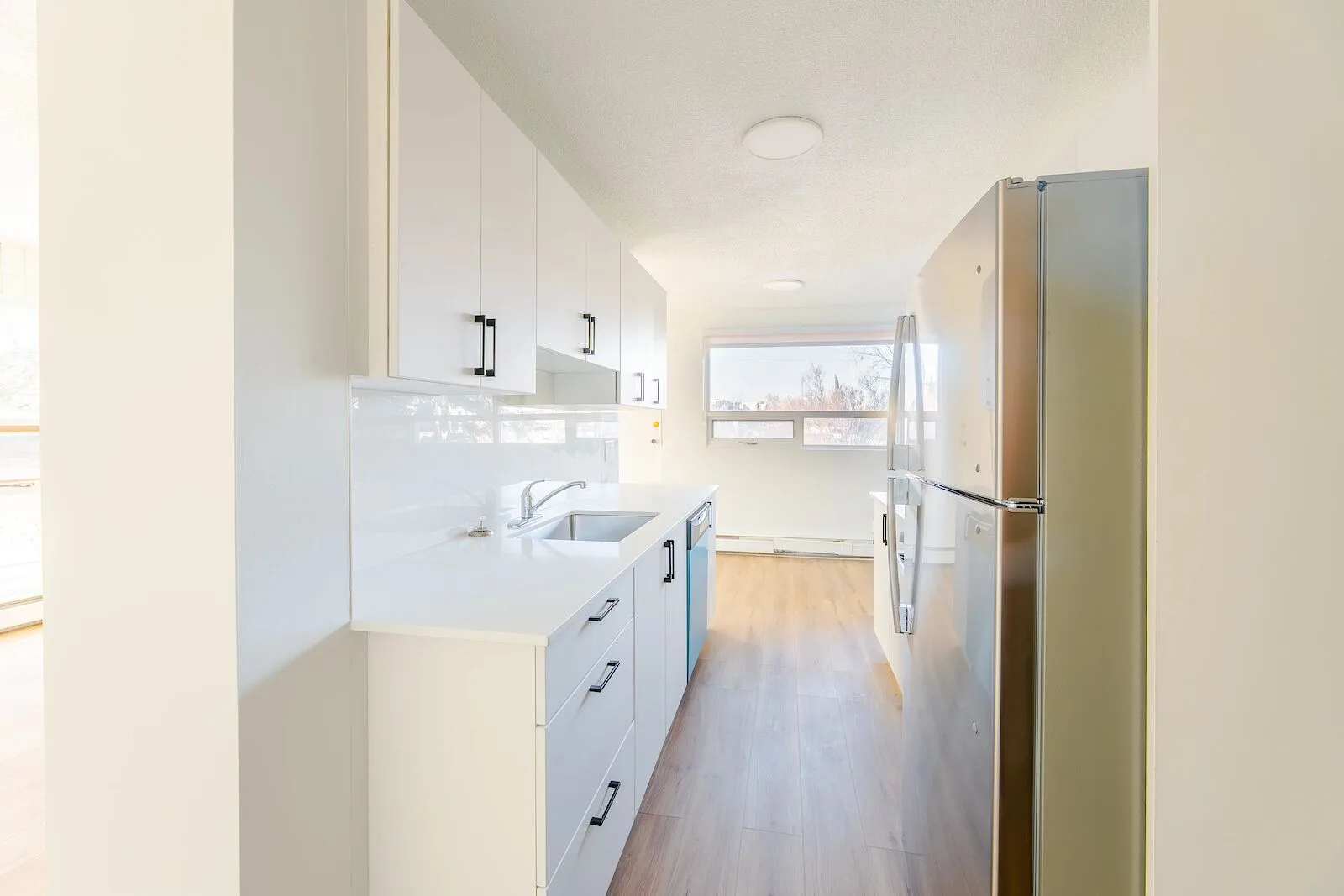 Beautifully renovated suites in Britannia | Quartz countertops and 5 piece stainless-steel appliances!